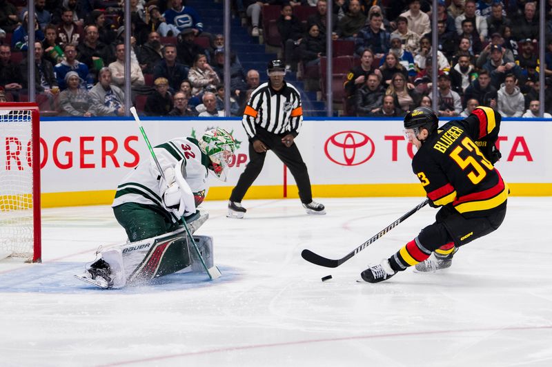 Dec 7, 2023; Vancouver, British Columbia, CAN; Vancouver Canucks forward Teddy Blueger (53) prepares to shoot on Minnesota Wild goalie Filip Gustavsson (32) in the third period at Rogers Arena. Vancouver won 2-0.  Mandatory Credit: Bob Frid-USA TODAY Sports