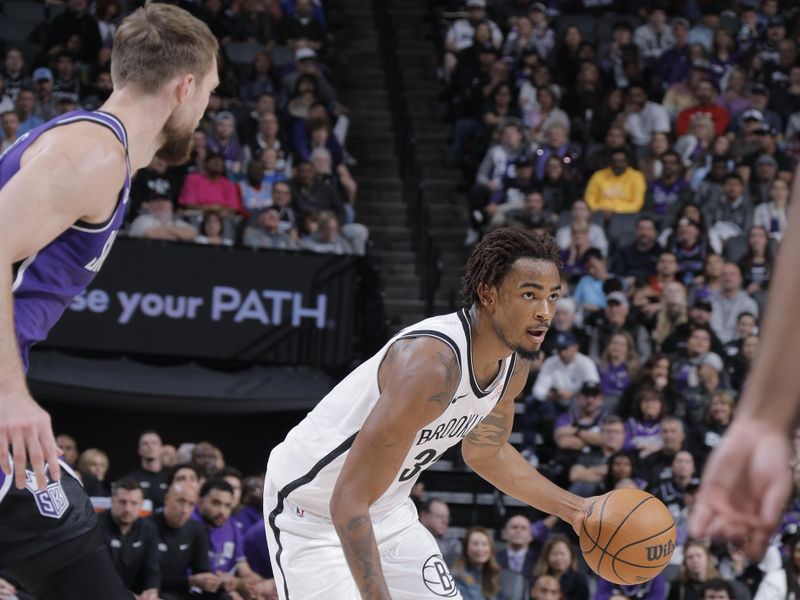 SACRAMENTO, CA - NOVEMBER 24: Nicolas Claxton #33 of the Brooklyn Nets dribbles the ball during the game against the Sacramento Kings on November 24, 2024 at Golden 1 Center in Sacramento, California. NOTE TO USER: User expressly acknowledges and agrees that, by downloading and or using this Photograph, user is consenting to the terms and conditions of the Getty Images License Agreement. Mandatory Copyright Notice: Copyright 2024 NBAE (Photo by Rocky Widner/NBAE via Getty Images)