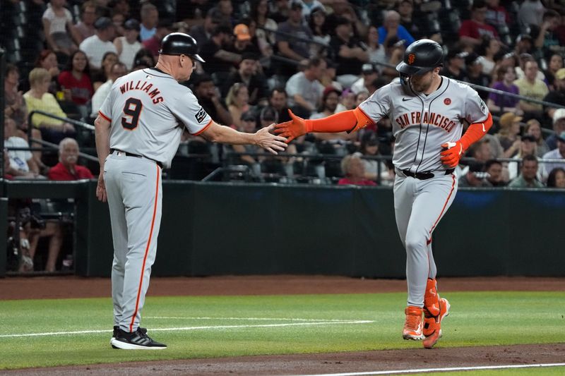 Sep 24, 2024; Phoenix, Arizona, USA; San Francisco Giants catcher Patrick Bailey (14) celebrates with third base coach Matt Williams (9) after hitting a solo home run against the Arizona Diamondbacks in the second inning at Chase Field. Mandatory Credit: Rick Scuteri-Imagn Images