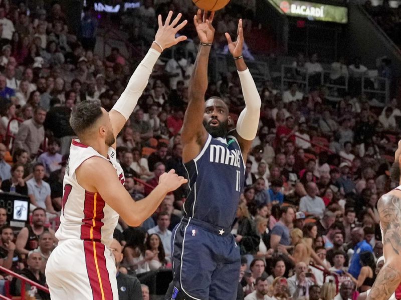 MIAMI, FL - APRIL 1:  Tim Hardaway Jr. #11 of the Dallas Mavericks shoots a three point basket against the Miami Heat on April 1, 2023 at FTX Arena in Miami, Florida. NOTE TO USER: User expressly acknowledges and agrees that, by downloading and or using this Photograph, user is consenting to the terms and conditions of the Getty Images License Agreement. Mandatory Copyright Notice: Copyright 2023 NBAE (Photo by Issac Baldizon/NBAE via Getty Images)