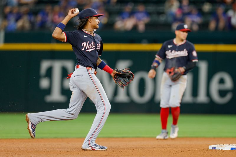 May 1, 2024; Arlington, Texas, USA; Washington Nationals shortstop CJ Abrams (5) fields a ground ball during the eighth inning against the Texas Rangers at Globe Life Field. Mandatory Credit: Andrew Dieb-USA TODAY Sports