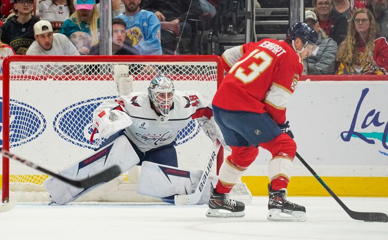 Dec 29, 2025; Sunrise, Florida, USA; Washington Capitals goaltender Logan Thompson (48) prepares to make a save against Florida Panthers center Sam Reinhart (13) during the second period at Amerant Bank Arena. Mandatory Credit: Jeff Romance-Imagn Images