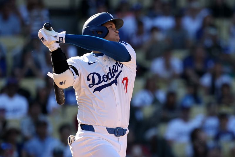 Sep 22, 2024; Los Angeles, California, USA;  Los Angeles Dodgers designated hitter Shohei Ohtani (17) hits a home run during the ninth inning against the Colorado Rockies at Dodger Stadium. Mandatory Credit: Kiyoshi Mio-Imagn Images