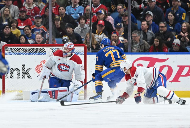 Nov 11, 2024; Buffalo, New York, USA; Buffalo Sabres right wing JJ Peterka (77) scores a goal against Montreal Canadiens goaltender Cayden Primeau (30) with defenseman Mike Matheson (8) looking on in the third period at KeyBank Center. Mandatory Credit: Mark Konezny-Imagn Images