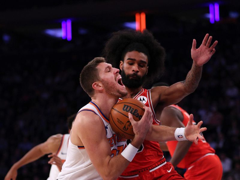 NEW YORK, NEW YORK - NOVEMBER 13: Matt Ryan #37 of the New York Knicks drives to the basket against Coby White #0 of the Chicago Bulls during the first quarter at Madison Square Garden on November 13, 2024 in New York City. NOTE TO USER: User expressly acknowledges and agrees that, by downloading and or using this photograph, User is consenting to the terms and conditions of the Getty Images License Agreement. (Photo by Elsa/Getty Images)