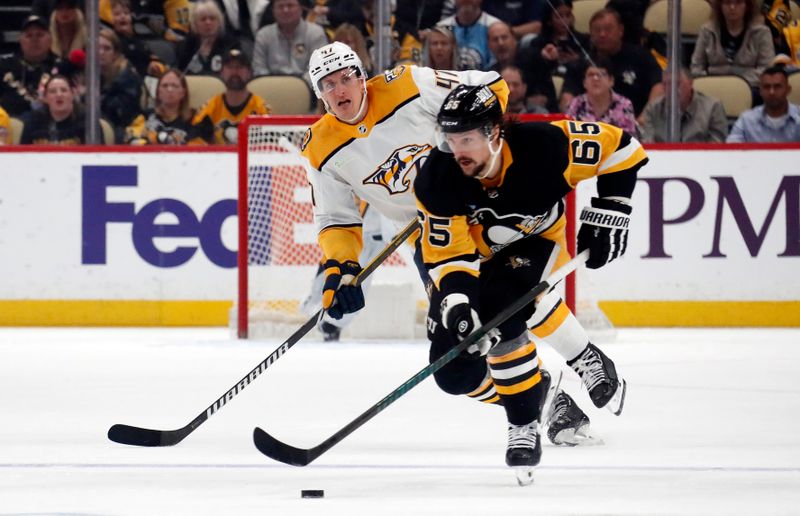 Apr 15, 2024; Pittsburgh, Pennsylvania, USA;  Pittsburgh Penguins defenseman Erik Karlsson (65) moves the puck ahead of Nashville Predators right wing Michael McCarron (47) during the first period  at PPG Paints Arena. Mandatory Credit: Charles LeClaire-USA TODAY Sports