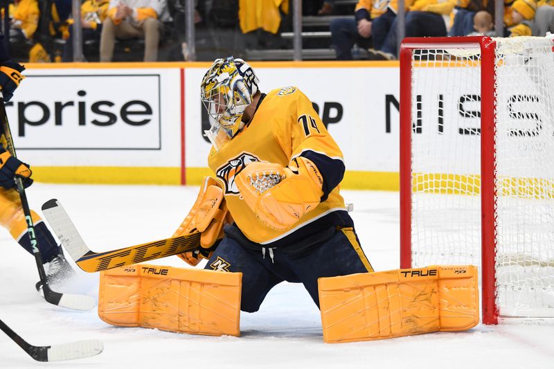 Jan 2, 2024; Nashville, Tennessee, USA; Nashville Predators goaltender Juuse Saros (74) makes a save during the second period against the Chicago Blackhawks at Bridgestone Arena. Mandatory Credit: Christopher Hanewinckel-USA TODAY Sports