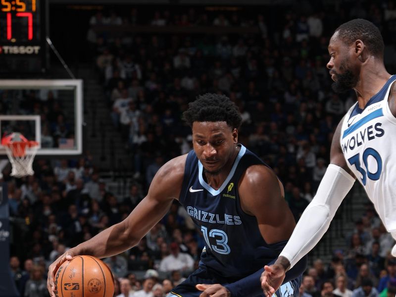 MINNEAPOLIS, MN -  JANUARY 11: Jaren Jackson Jr. #13 of the Memphis Grizzlies handles the ball during the game against the Minnesota Timberwolves on January 11, 2025 at Target Center in Minneapolis, Minnesota. NOTE TO USER: User expressly acknowledges and agrees that, by downloading and or using this Photograph, user is consenting to the terms and conditions of the Getty Images License Agreement. Mandatory Copyright Notice: Copyright 2025 NBAE (Photo by David Sherman/NBAE via Getty Images)