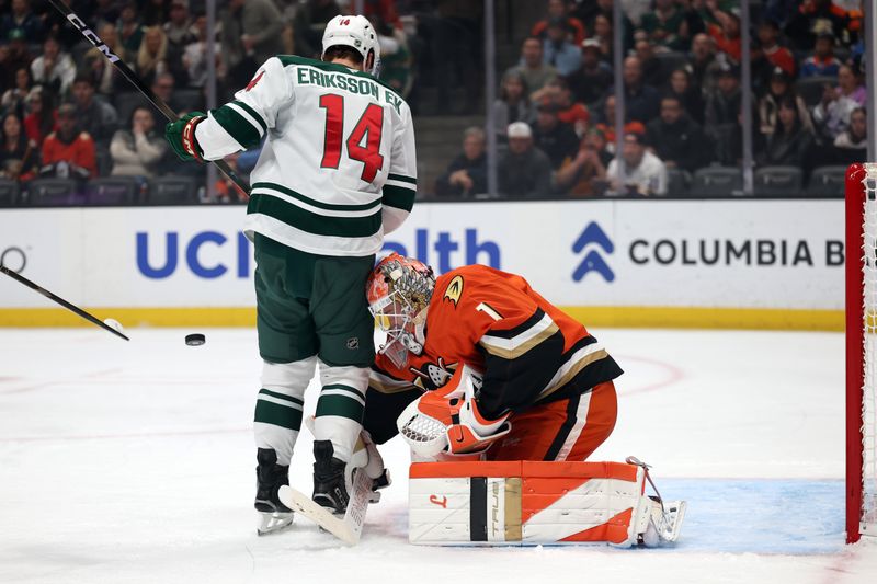 Jan 2, 2026; Anaheim, California, USA;  Minnesota Wild center Joel Eriksson Ek (14) screens Anaheim Ducks goaltender Lukas Dostal (1) during the first period at Honda Center. Mandatory Credit: Kiyoshi Mio-Imagn Images