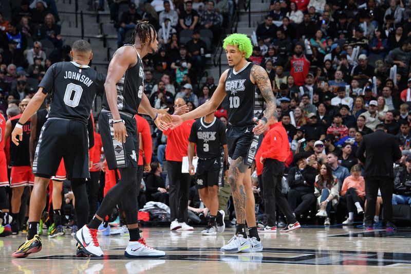 SAN ANTONIO, TX - DECEMBER 5:  Keldon Johnson #0 and Jeremy Sochan #10 of the San Antonio Spurs high five during the game against the Chicago Bulls on December 5, 2024 at the Frost Bank Center in San Antonio, Texas. NOTE TO USER: User expressly acknowledges and agrees that, by downloading and or using this photograph, user is consenting to the terms and conditions of the Getty Images License Agreement. Mandatory Copyright Notice: Copyright 2024 NBAE (Photos by Michael Gonzales/NBAE via Getty Images)