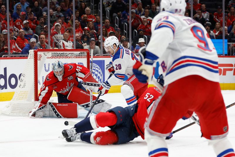 Oct 29, 2024; Washington, District of Columbia, USA; New York Rangers left wing Chris Kreider (20) shoots the puck on Washington Capitals goaltender Logan Thompson (48) in the second period at Capital One Arena. Mandatory Credit: Geoff Burke-Imagn Images