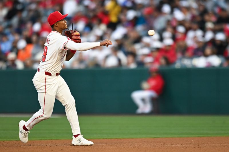 May 11, 2024; Anaheim, California, USA; Los Angeles Angels second baseman Kyren Paris (19) fields the ball against the Kansas City Royals during the fourth inning at Angel Stadium. Mandatory Credit: Jonathan Hui-USA TODAY Sports