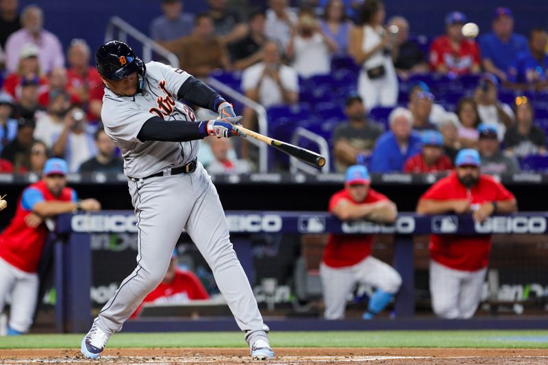 Jul 29, 2023; Miami, Florida, USA; Detroit Tigers designated hitter Miguel Cabrera (24) hits a double against the Miami Marlins during the second inning at loanDepot Park. Mandatory Credit: Sam Navarro-USA TODAY Sports