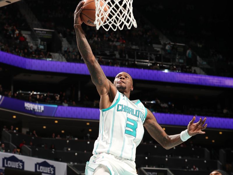 CHARLOTTE, NC - JANUARY 4: Terry Rozier #3 of the Charlotte Hornets drives to the basket during the game against the Memphis Grizzlies on January 4, 2023 at Spectrum Center in Charlotte, North Carolina. NOTE TO USER: User expressly acknowledges and agrees that, by downloading and or using this photograph, User is consenting to the terms and conditions of the Getty Images License Agreement. Mandatory Copyright Notice: Copyright 2023 NBAE (Photo by Kent Smith/NBAE via Getty Images)