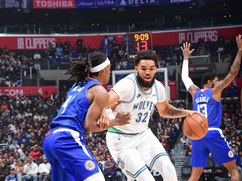 LOS ANGELES, CA - FEBRUARY 12:  Karl-Anthony Towns #32 of the Minnesota Timberwolves goes to the basket during the game on February 12, 2024 at Crypto.Com Arena in Los Angeles, California. NOTE TO USER: User expressly acknowledges and agrees that, by downloading and/or using this Photograph, user is consenting to the terms and conditions of the Getty Images License Agreement. Mandatory Copyright Notice: Copyright 2024 NBAE (Photo by Adam Pantozzi/NBAE via Getty Images)