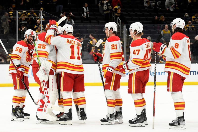 Feb 6, 2024; Boston, Massachusetts, USA; The Calgary Flames celebrate their victory over the Boston Bruins at TD Garden. Mandatory Credit: Bob DeChiara-USA TODAY Sports