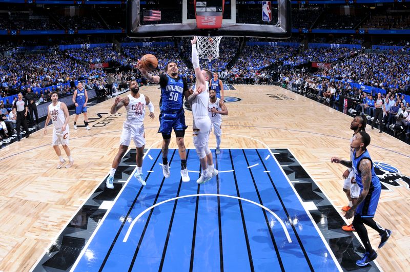 ORLANDO, FL - APRIL 25: Cole Anthony #50 of the Orlando Magic goes to the basket during the game against the Cleveland Cavaliers during Round 1 Game 3 of the 2024 NBA Playoffs on April 25, 2024 at Kia Center in Orlando, Florida. NOTE TO USER: User expressly acknowledges and agrees that, by downloading and or using this photograph, User is consenting to the terms and conditions of the Getty Images License Agreement. Mandatory Copyright Notice: Copyright 2023 NBAE (Photo by Fernando Medina/NBAE via Getty Images)