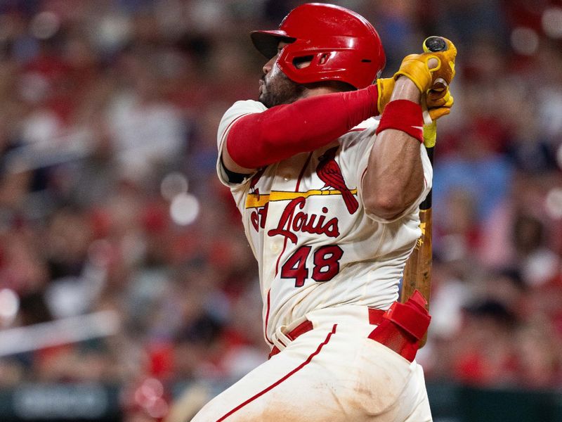 Sep 30, 2023; St. Louis, Missouri, USA; St. Louis Cardinals catcher Ivan Herrera (48) hits a base hit in the eighth inning against the Cincinnati Reds at Busch Stadium. Mandatory Credit: Zach Dalin-USA TODAY Sports