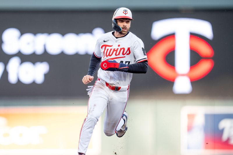 Apr 23, 2025; Minneapolis, Minnesota, USA; Chicago White Sox right fielder Joshua Palacios (47) heads to third base off a double from second base Luke Keaschall (15) against the Chicago White Sox in the first inning at Target Field. Mandatory Credit: Matt Blewett-Imagn Images
