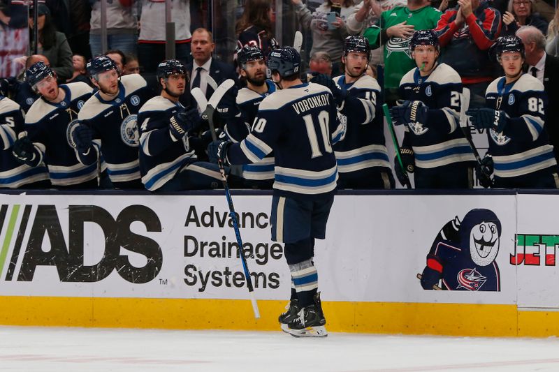 Dec 31, 2024; Columbus, Ohio, USA; Columbus Blue Jackets left wing Dmitri Voronkov (10) celebrates his goal against the Carolina Hurricanes during the third period at Nationwide Arena. Mandatory Credit: Russell LaBounty-Imagn Images