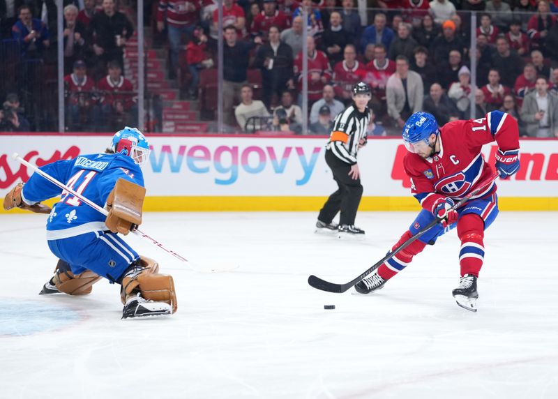 Jan 29, 2026; Montreal, Quebec, CAN; Montreal Canadiens forward Nick Suzuki (14) scores a goal against Colorado Avalanche goalie Scott Wedgewood (41) during the first period at the Bell Centre. Mandatory Credit: Eric Bolte-Imagn Images