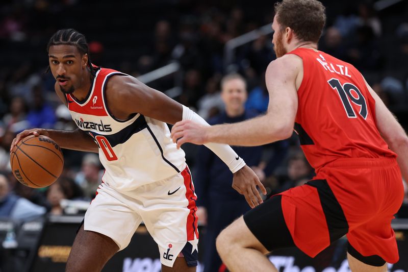 WASHINGTON, DC - OCTOBER 11: Alex Sarr #20 of the Washington Wizards dribbles the ball against the Toronto Raptors during the first half of a preseason game at Capital One Arena on October 11, 2024 in Washington, DC. NOTE TO USER: User expressly acknowledges and agrees that, by downloading and or using this photograph, User is consenting to the terms and conditions of the Getty Images License Agreement. (Photo by Patrick Smith/Getty Images)