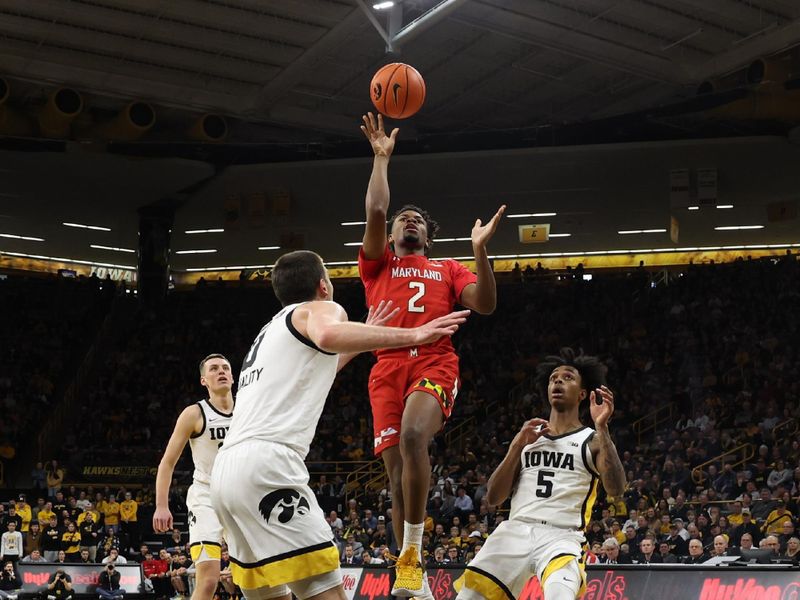 Jan 15, 2023; Iowa City, Iowa, USA; Maryland Terrapins guard Jahari Long (2) scores in front of Iowa Hawkeyes forward Filip Rebraca (0) at Carver-Hawkeye Arena. Mandatory Credit: Reese Strickland-USA TODAY Sports