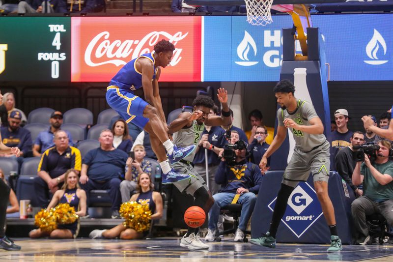 Jan 31, 2026; Morgantown, West Virginia, USA; Baylor Bears guard Tounde Yessoufou (24) steals the ball from West Virginia Mountaineers forward Brenen Lorient (0) during the first half at Hope Coliseum. Mandatory Credit: Ben Queen-Imagn Images