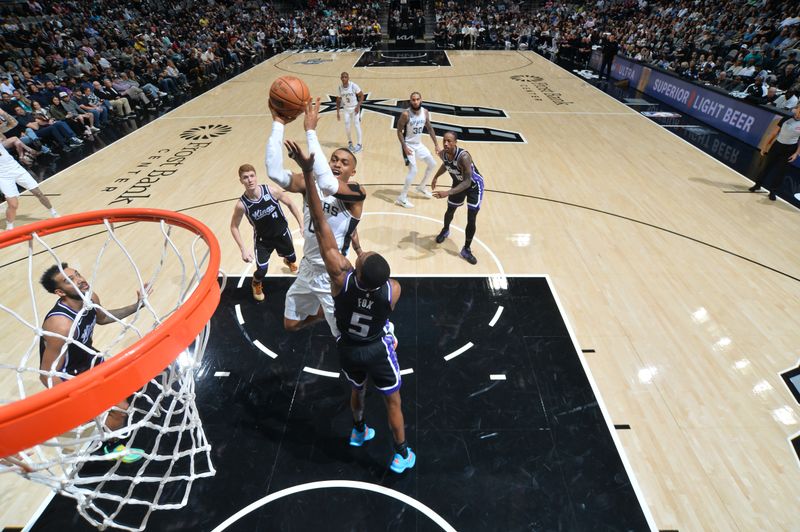 SAN ANTONIO, TX - NOVEMBER 11:   Keldon Johnson #0 of the San Antonio Spurs drives to the basket during the game against the Sacramento Kings during a regular season game on November 11, 2024 at the Frost Bank Center in San Antonio, Texas. NOTE TO USER: User expressly acknowledges and agrees that, by downloading and or using this photograph, user is consenting to the terms and conditions of the Getty Images License Agreement. Mandatory Copyright Notice: Copyright 2024 NBAE (Photos by Michael Gonzales/NBAE via Getty Images)