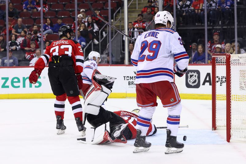 Sep 30, 2024; Newark, New Jersey, USA; New York Rangers left wing Anton Blidh (25) celebrates his goal against the New Jersey Devils during the third period at Prudential Center. Mandatory Credit: Ed Mulholland-Imagn Images