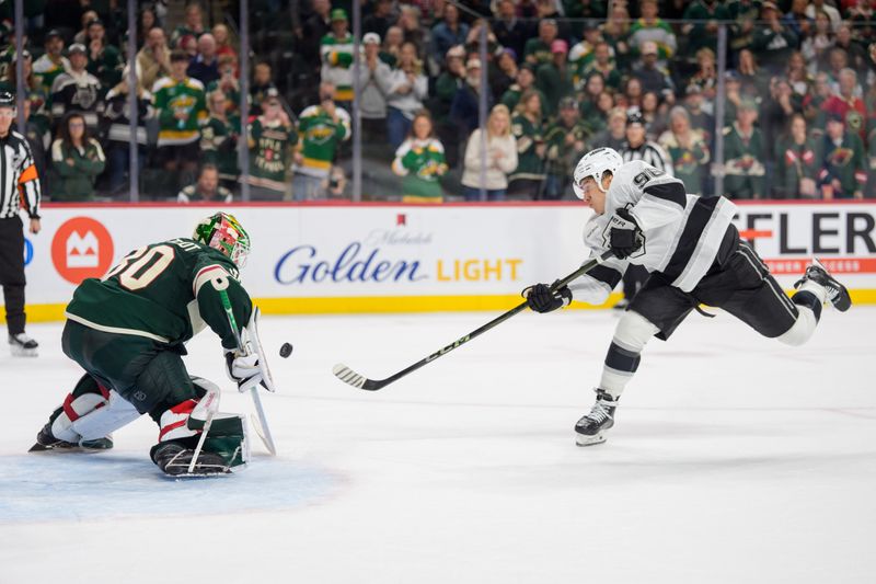 Oct 13, 2025; Saint Paul, Minnesota, USA; Minnesota Wild goaltender Jesper Wallstedt (30) stops Los Angeles Kings left wing Andrei Kuzmenko (96) in shootouts to win the game 4-3 at Grand Casino Arena. Mandatory Credit: Matt Blewett-Imagn Images