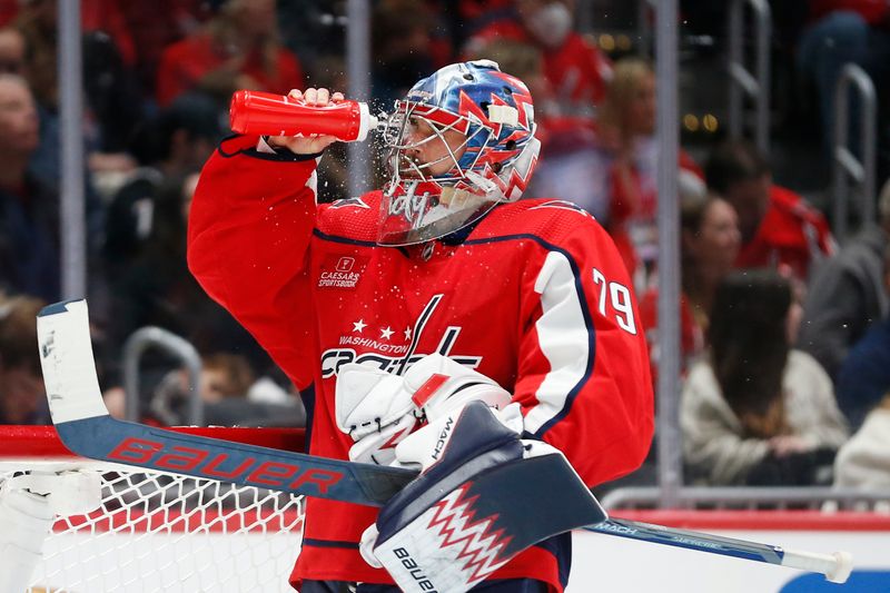 Nov 18, 2023; Washington, District of Columbia, USA; Washington Capitals goaltender Charlie Lindgren (79) squirts his face with water against the Columbus Blue Jackets during the second period at Capital One Arena. Mandatory Credit: Amber Searls-USA TODAY Sports