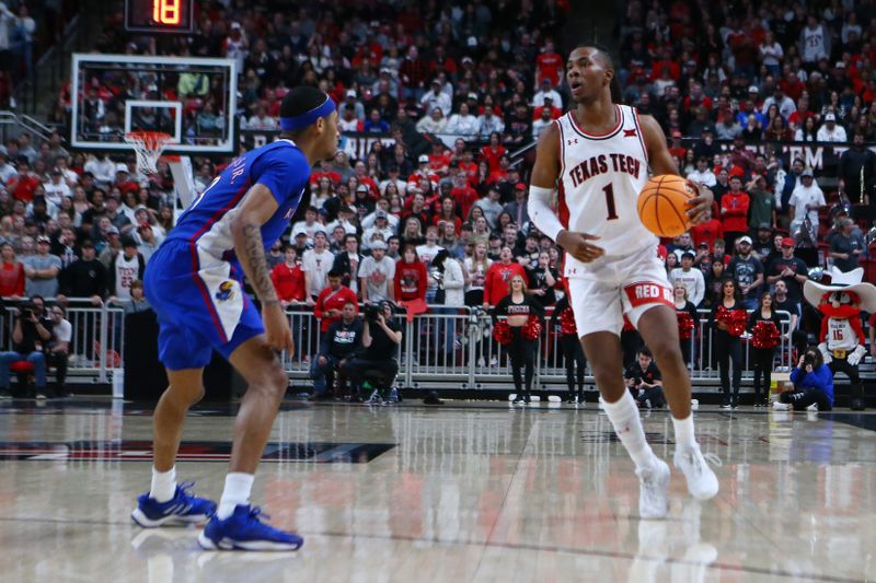 Jan 3, 2023; Lubbock, Texas, USA;  Texas Tech Red Raiders guard Lamar Washington (1) dribbles the ball against Kansas Jayhawks guard Dajuan Harris Jr (3) in the second half at United Supermarkets Arena. Mandatory Credit: Michael C. Johnson-USA TODAY Sports