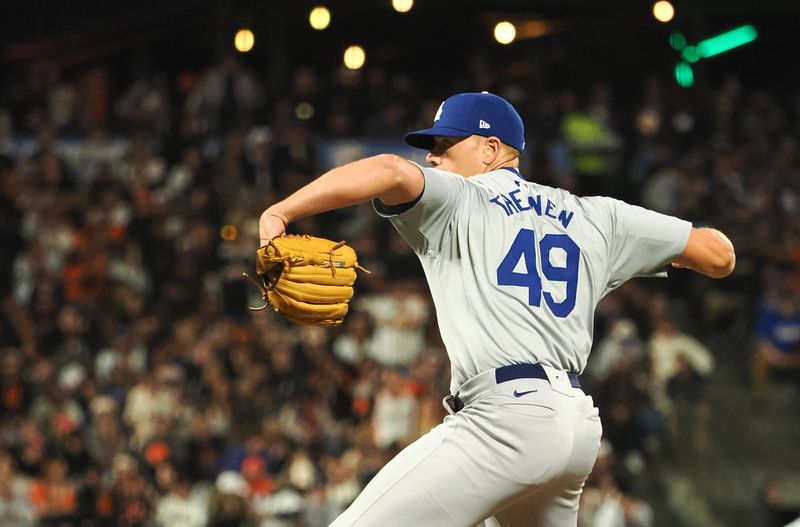 Jun 28, 2024; San Francisco, California, USA; Los Angeles Dodgers relief pitcher Blake Treinen (49) pitches against the San Francisco Giants during the ninth inning at Oracle Park. Mandatory Credit: Kelley L Cox-USA TODAY Sports