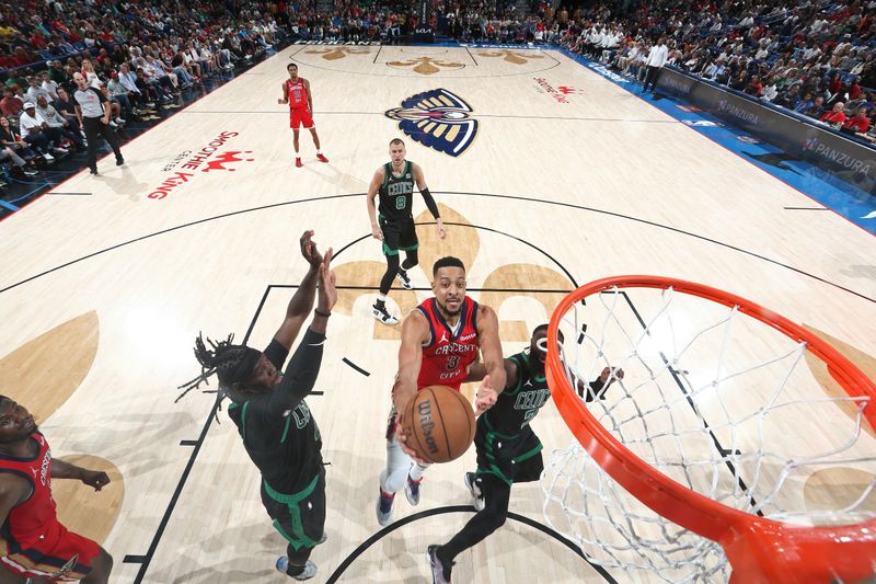 NEW ORLEANS, LA - MARCH 30: CJ McCollum #3 of the New Orleans Pelicans drives to the basket during the game against the Boston Celtics on March 30, 2024 at the Smoothie King Center in New Orleans, Louisiana. NOTE TO USER: User expressly acknowledges and agrees that, by downloading and or using this Photograph, user is consenting to the terms and conditions of the Getty Images License Agreement. Mandatory Copyright Notice: Copyright 2024 NBAE (Photo by Layne Murdoch Jr./NBAE via Getty Images)