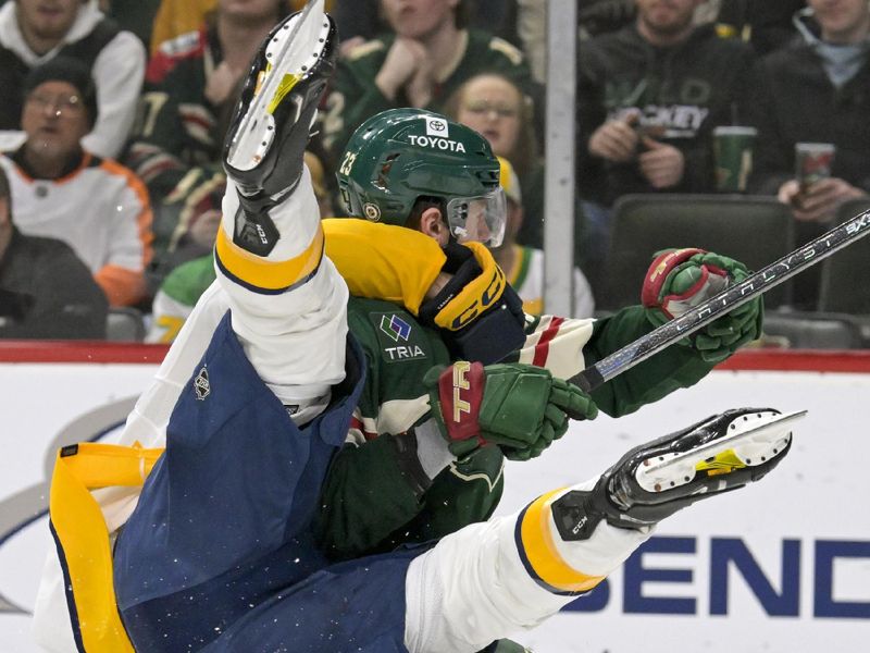 Jan 25, 2024; Saint Paul, Minnesota, USA; Nashville Predators defenseman Alexandre Carrier (45) contacts Minnesota Wild forward Marco Rossi (23) during the second period at Xcel Energy Center. Mandatory Credit: Nick Wosika-USA TODAY Sports