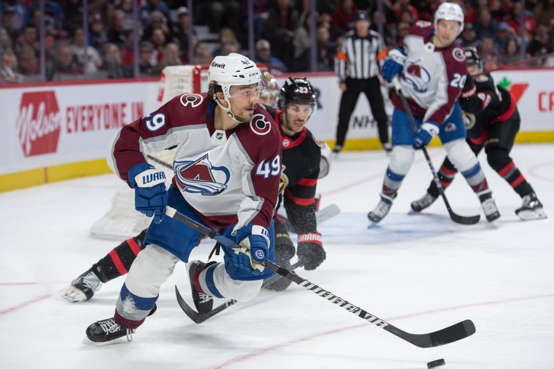 Jan 16, 2024; Ottawa, Ontario, CAN; Colorado Avalanche defenseman Samuel Girard (49) skates with the puck in the second period against the Ottawa Senators at the Canadian Tire Centre. Mandatory Credit: Marc DesRosiers-USA TODAY Sports