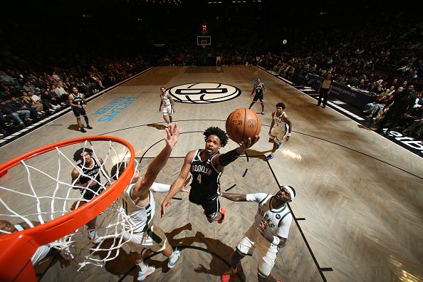 BROOKLYN, NY - DECEMBER 27: Dennis Smith Jr. #4 of the Brooklyn Nets drives to the basket during the game against the Milwaukee Bucks on December 27, 2023 at Barclays Center in Brooklyn, New York. NOTE TO USER: User expressly acknowledges and agrees that, by downloading and or using this Photograph, user is consenting to the terms and conditions of the Getty Images License Agreement. Mandatory Copyright Notice: Copyright 2023 NBAE (Photo by Nathaniel S. Butler/NBAE via Getty Images)