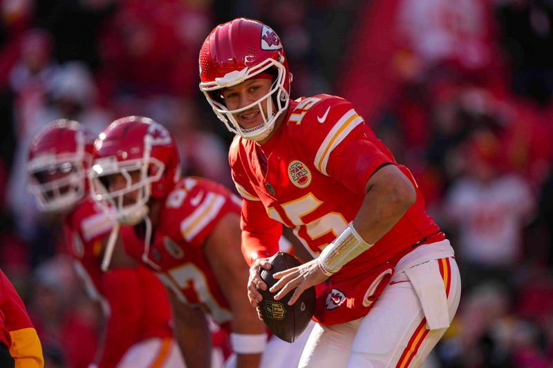 Kansas City Chiefs quarterback Patrick Mahomes (15) warms up before the start of an NFL football game against the Las Vegas Raiders in Kansas City, Mo., Friday, Nov. 29, 2024. (AP Photo/Charlie Riedel)