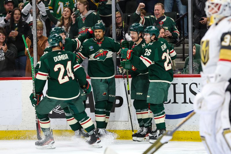 Apr 3, 2023; Saint Paul, Minnesota, USA; Minnesota Wild right wing Brandon Duhaime (21) celebrates his goal with teammates during the second period against the Vegas Golden Knights at Xcel Energy Center. Mandatory Credit: Matt Krohn-USA TODAY Sports