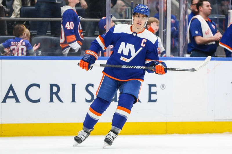 Feb 24, 2024; Elmont, New York, USA;  New York Islanders left wing Anders Lee (27) circles back to center ice after scoring a goal in the third period against the Tampa Bay Lightning at UBS Arena. Mandatory Credit: Wendell Cruz-USA TODAY Sports