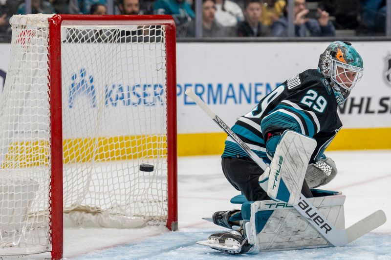 Feb 19, 2024; San Jose, California, USA; San Jose Sharks goalie Mackenzie Blackwood (29) is unable to make the save on the puck during the first period against the Vegas Golden Knights at SAP Center at San Jose. Mandatory Credit: Neville E. Guard-USA TODAY Sports