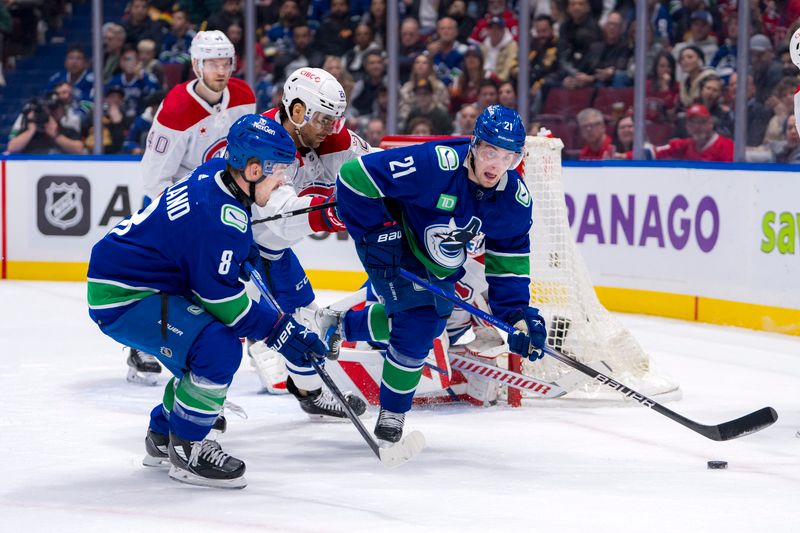 Mar 21, 2024; Vancouver, British Columbia, CAN; Vancouver Canucks forward Conor Garland (8) watches as Montreal Canadiens defenseman Johnathan Kovacevic (26) battles with forward Nils Hoglander (21) in the first period at Rogers Arena. Mandatory Credit: Bob Frid-USA TODAY Sports