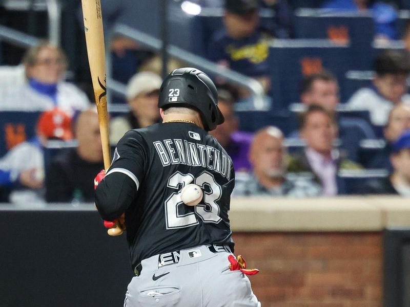 May 27, 2025; New York City, New York, USA; Chicago White Sox left fielder Andrew Benintendi (23) is hit by a pitch during the seventh inning against the New York Mets at Citi Field. Mandatory Credit: Vincent Carchietta-Imagn Images