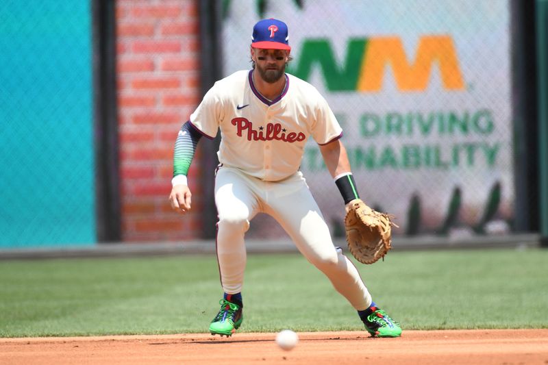 Jul 14, 2024; Philadelphia, Pennsylvania, USA; Philadelphia Phillies first baseman Bryce Harper (3) fields a groundball during the first inning against the Oakland Athletics at Citizens Bank Park. Mandatory Credit: Eric Hartline-USA TODAY Sports