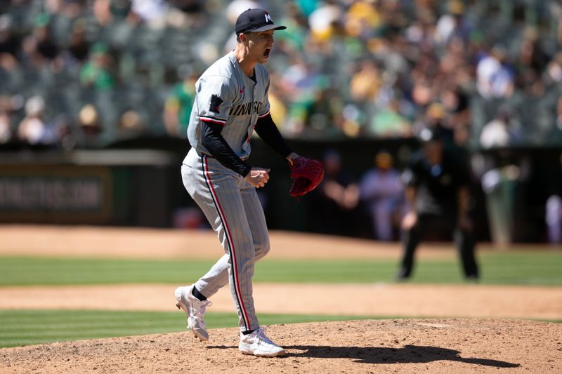 Jun 23, 2024; Oakland, California, USA; Minnesota Twins pitcher Griffin Jax (22) reacts to getting the final out against the Oakland Athletics during the ninth inning at Oakland-Alameda County Coliseum. Mandatory Credit: D. Ross Cameron-USA TODAY Sports