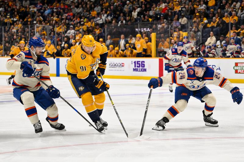 Jan 13, 2026; Nashville, Tennessee, USA;  Nashville Predators center Steven Stamkos (91) splits Edmonton Oilers defenseman Jake Walman (96) and defenseman Spencer Stastney (24) during the third period at Bridgestone Arena. Mandatory Credit: Steve Roberts-Imagn Images