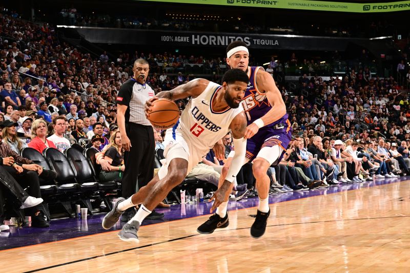 PHOENIX, AZ - APRIL  9:  Paul George #13 of the LA Clippers handles the ball during the game against the Phoenix Suns on April 9, 2024 at Footprint Center in Phoenix, Arizona. NOTE TO USER: User expressly acknowledges and agrees that, by downloading and or using this photograph, user is consenting to the terms and conditions of the Getty Images License Agreement. Mandatory Copyright Notice: Copyright 2024 NBAE (Photo by Kate Frese/NBAE via Getty Images)