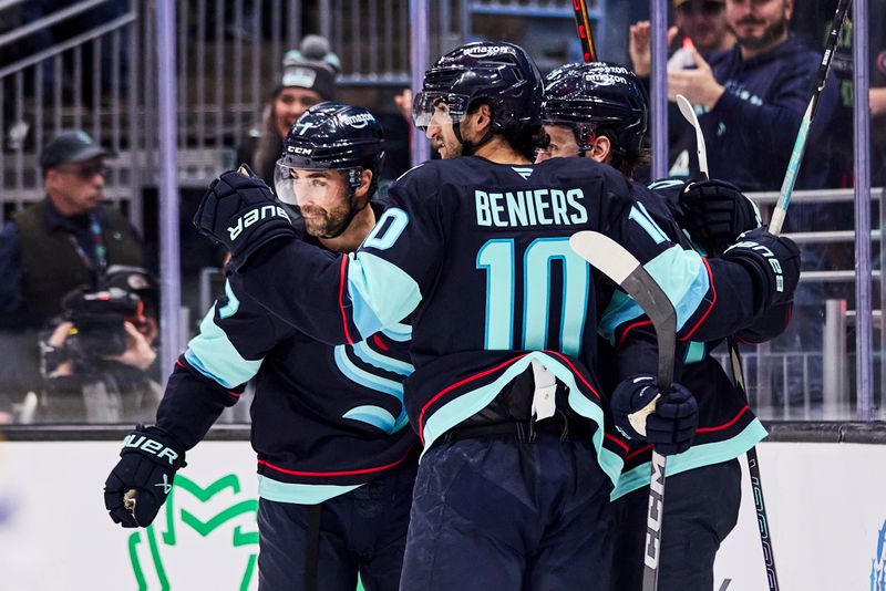 Dec 14, 2025; Seattle, Washington, USA; Seattle Kraken center Matty Beniers (10) celebrates after assisting a goal during the second period against the Buffalo Sabres at Climate Pledge Arena. Mandatory Credit: Blake Dahlin-Imagn Images