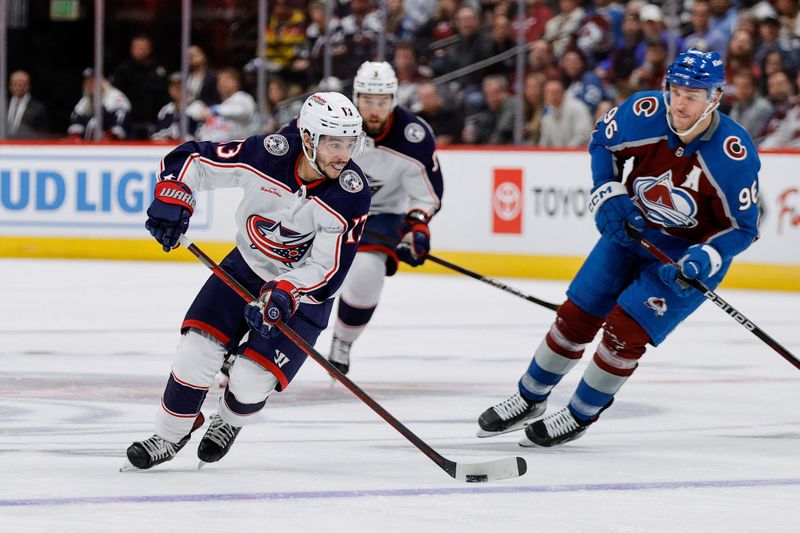 Mar 22, 2024; Denver, Colorado, USA; Columbus Blue Jackets left wing Johnny Gaudreau (13) controls the puck ahead of Colorado Avalanche right wing Mikko Rantanen (96) in the third period at Ball Arena. Mandatory Credit: Isaiah J. Downing-USA TODAY Sports